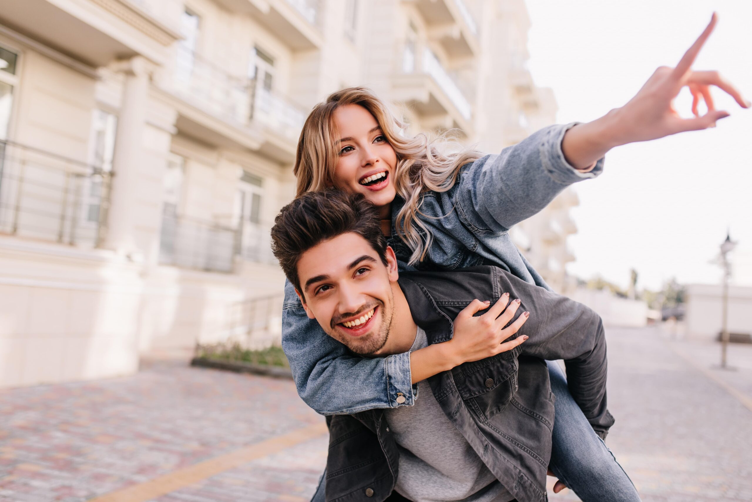 Couple laughing together outdoors